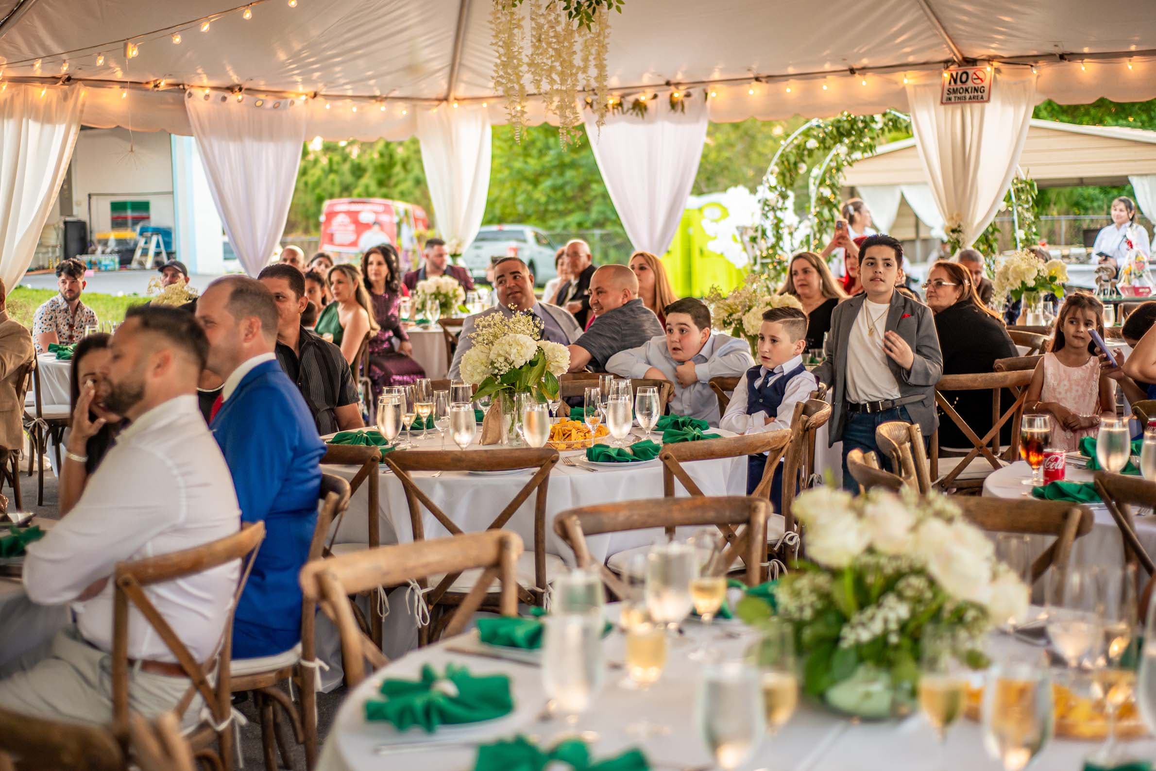 Guests seated under a string-lit reception tent, Cape Coral, Fort Myers, Bonita Springs and Naples event