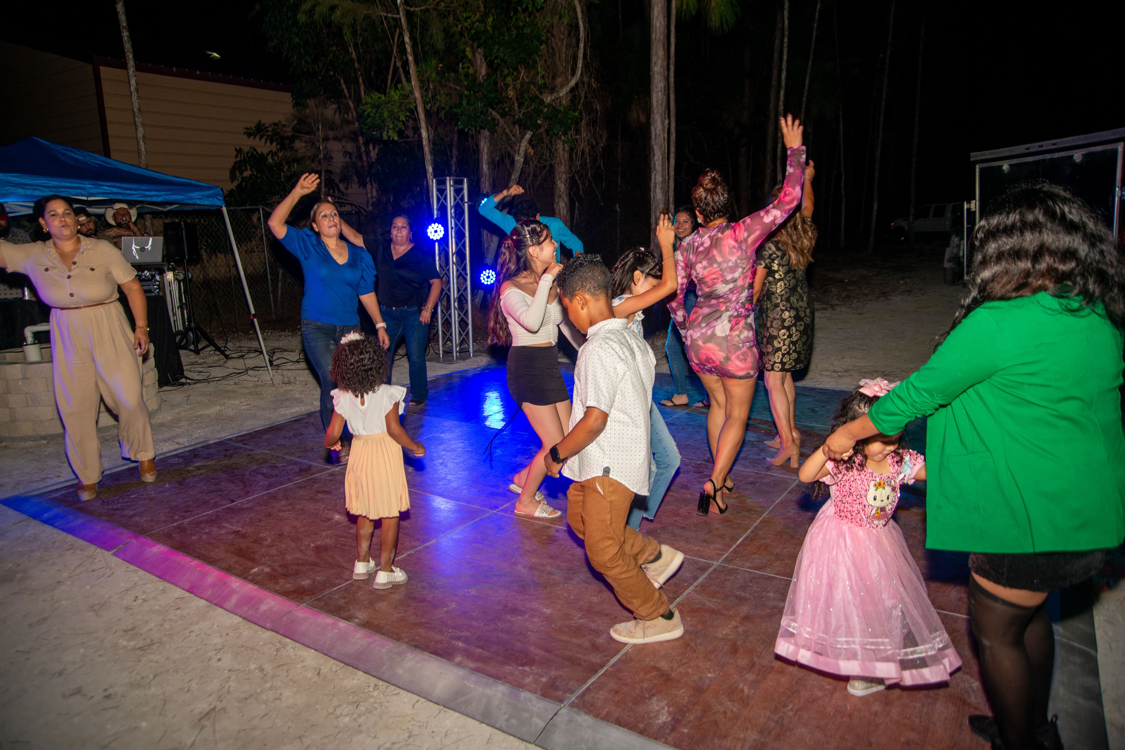 Family and friends dancing at an evening celebration, Cape Coral, Fort Myers, Bonita Springs and Naples