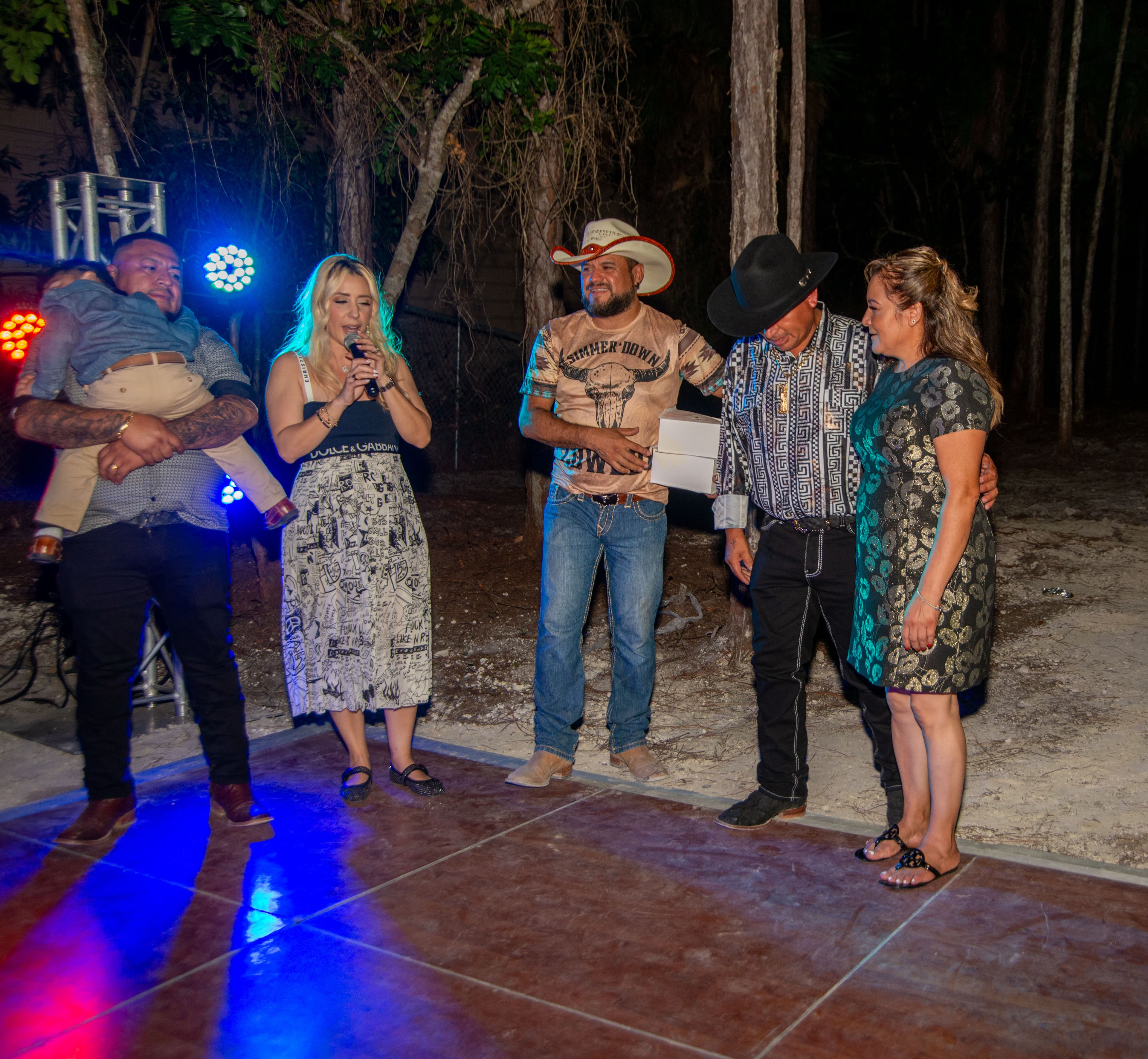 Gift presentation at an outdoor evening celebration, Cape Coral, Fort Myers, Bonita Springs and Naples