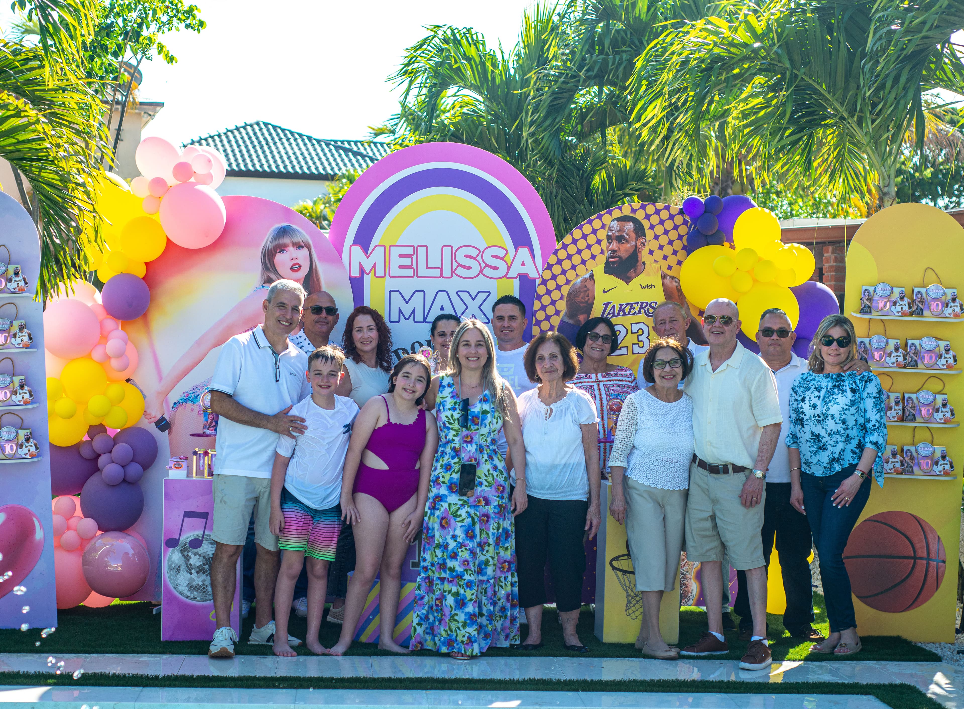 Family group photo at a poolside birthday party