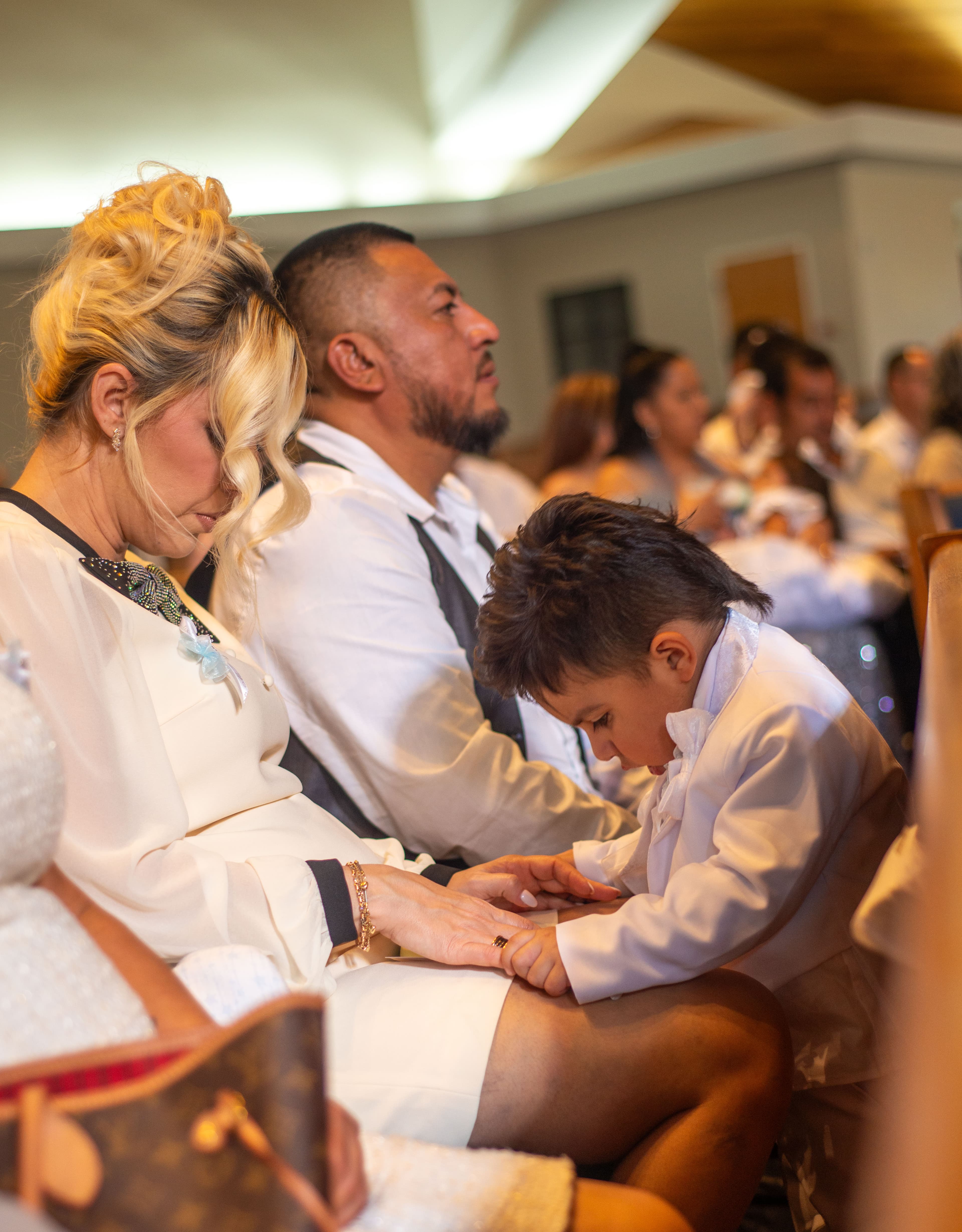 Intimate family moment during a christening service