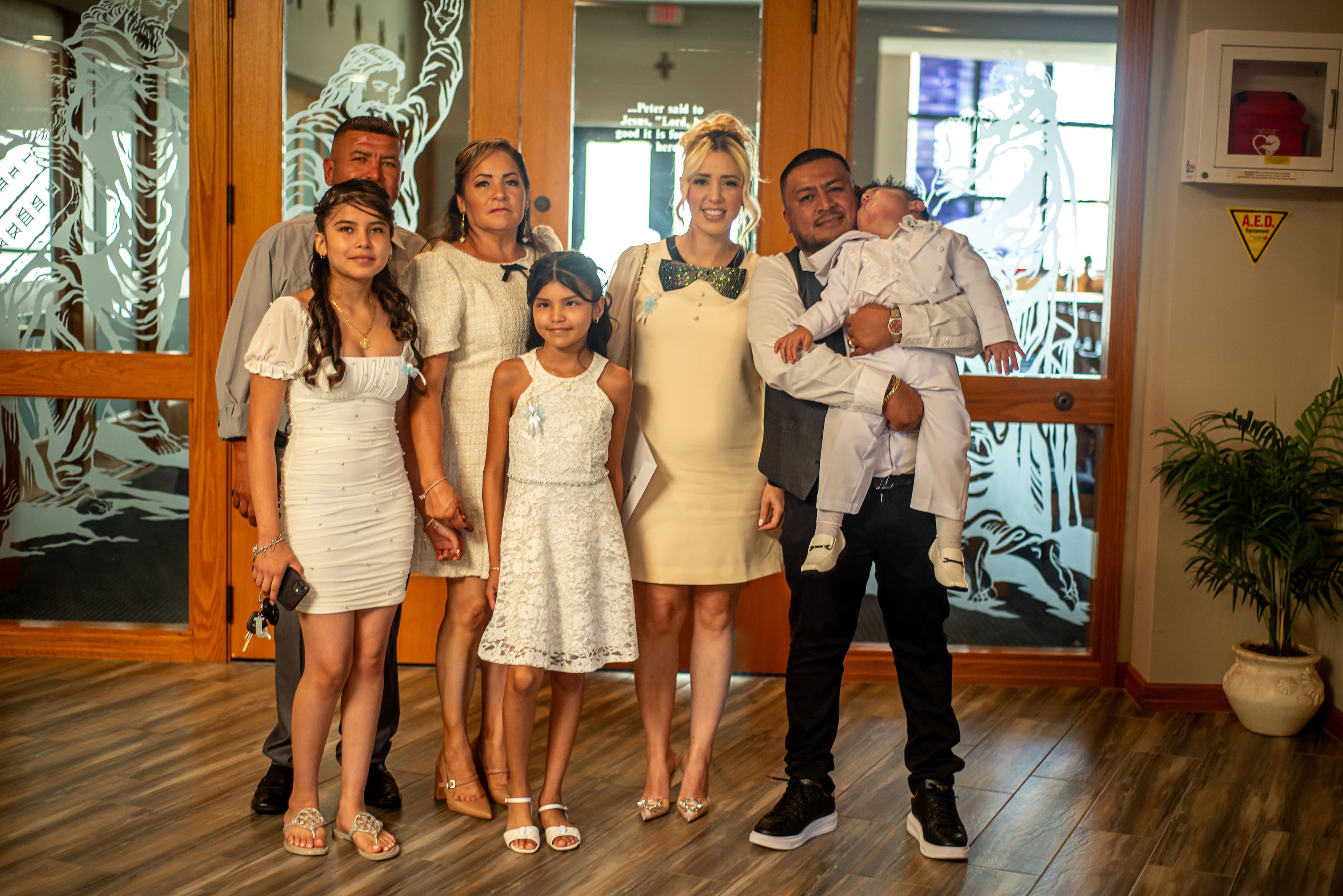 Family portrait in the church lobby after a christening