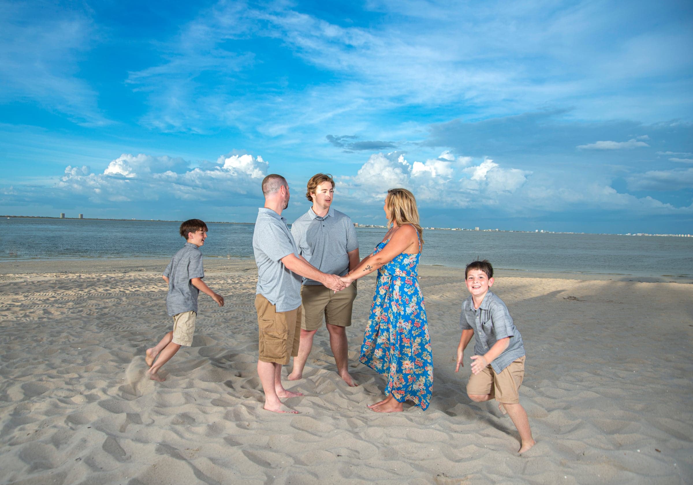 Candid family portrait on the beach, Fort Myers FL