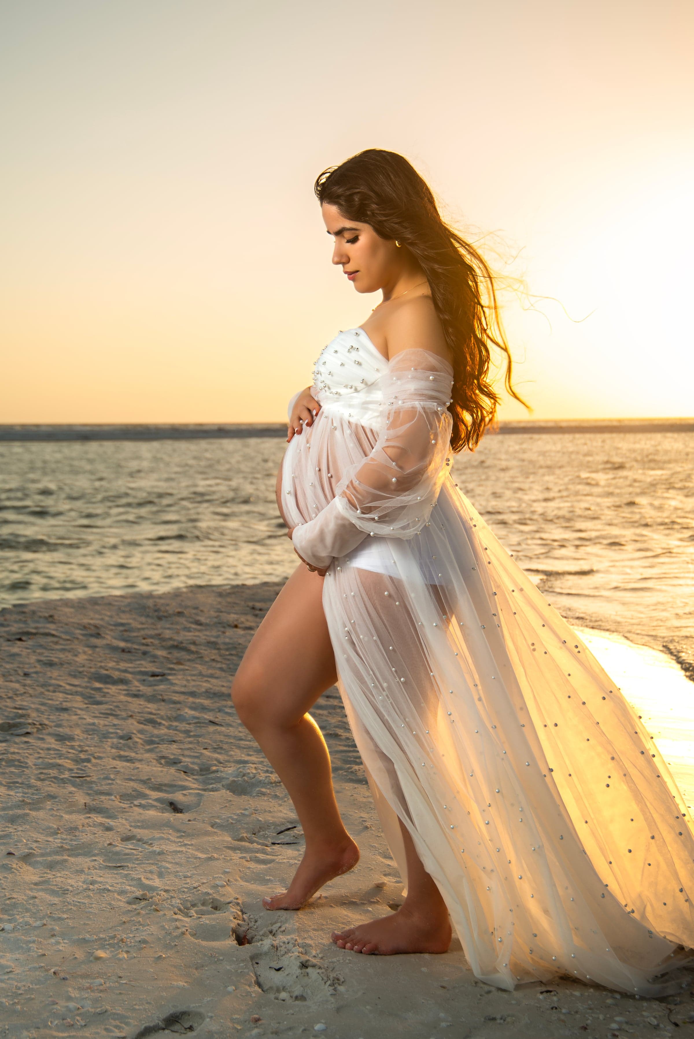 Maternity portrait at sunset beach, Southwest Florida