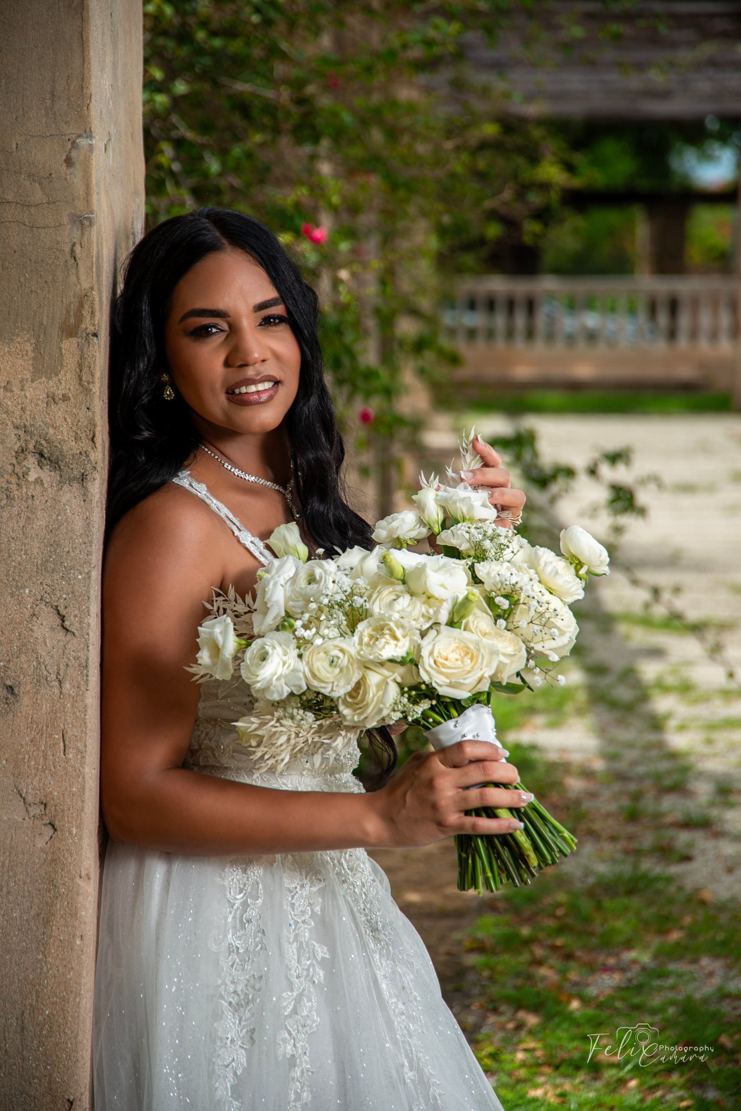 Bride with white bouquet, outdoor wedding photography