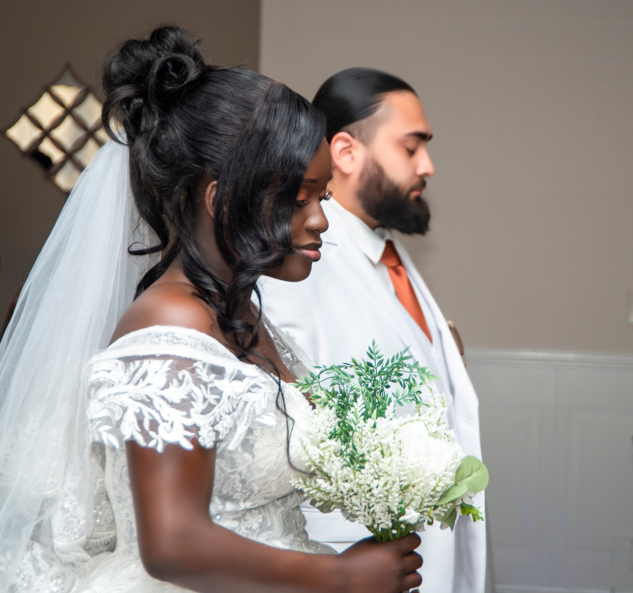 Wedding ceremony, couple praying together