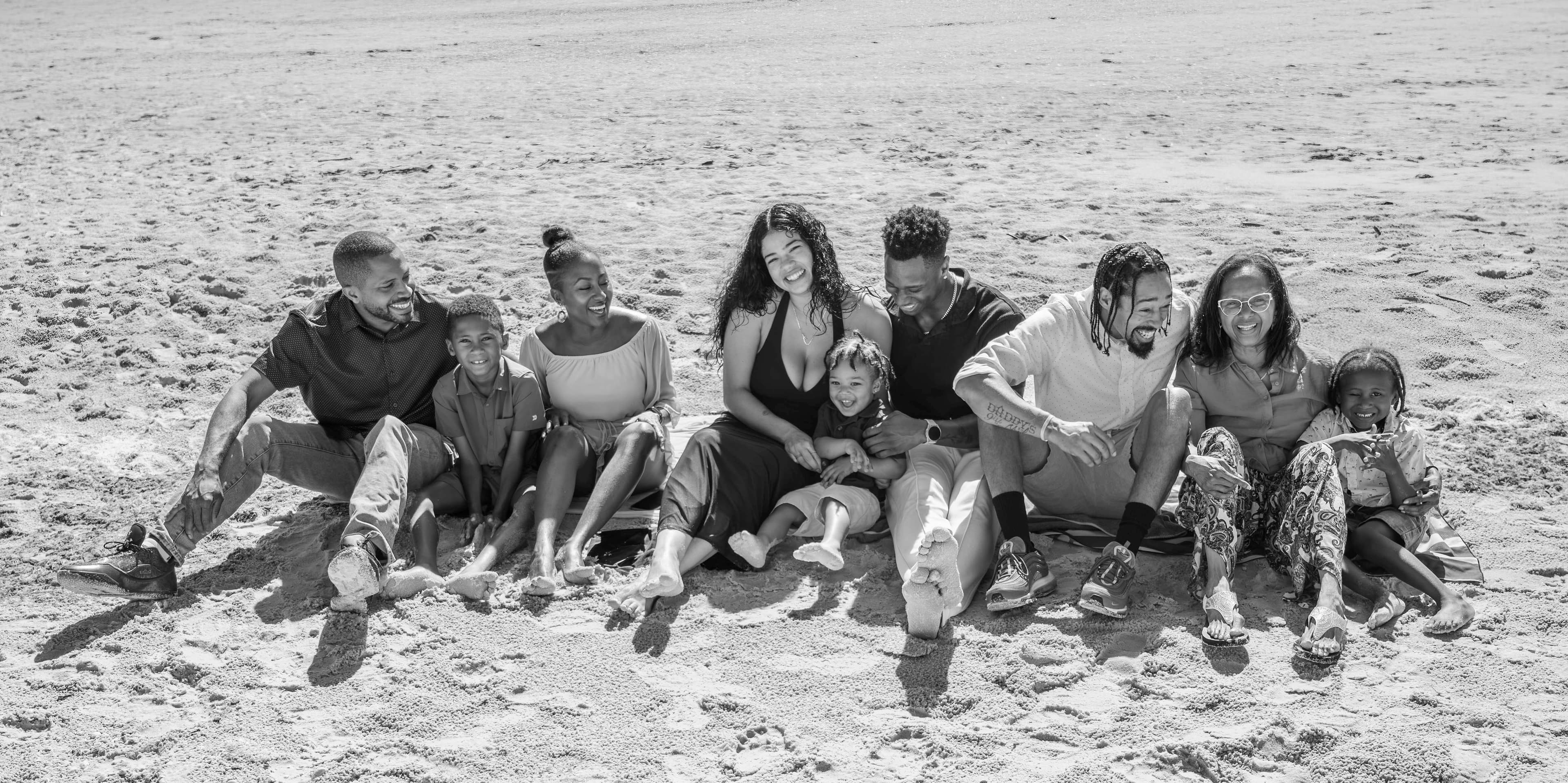 Extended family portrait on the beach at sunset