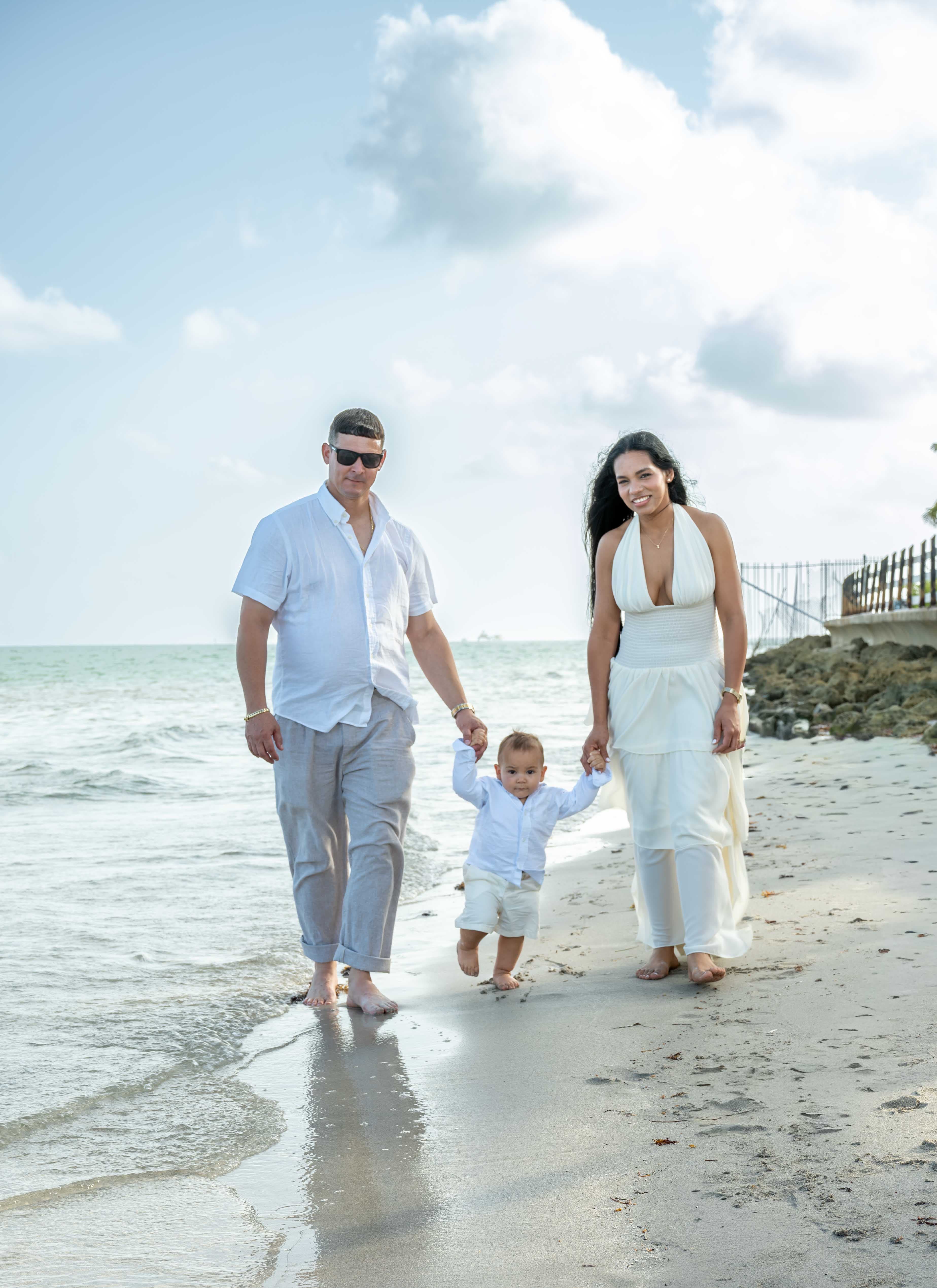 Mother, son and daughter portrait by the water