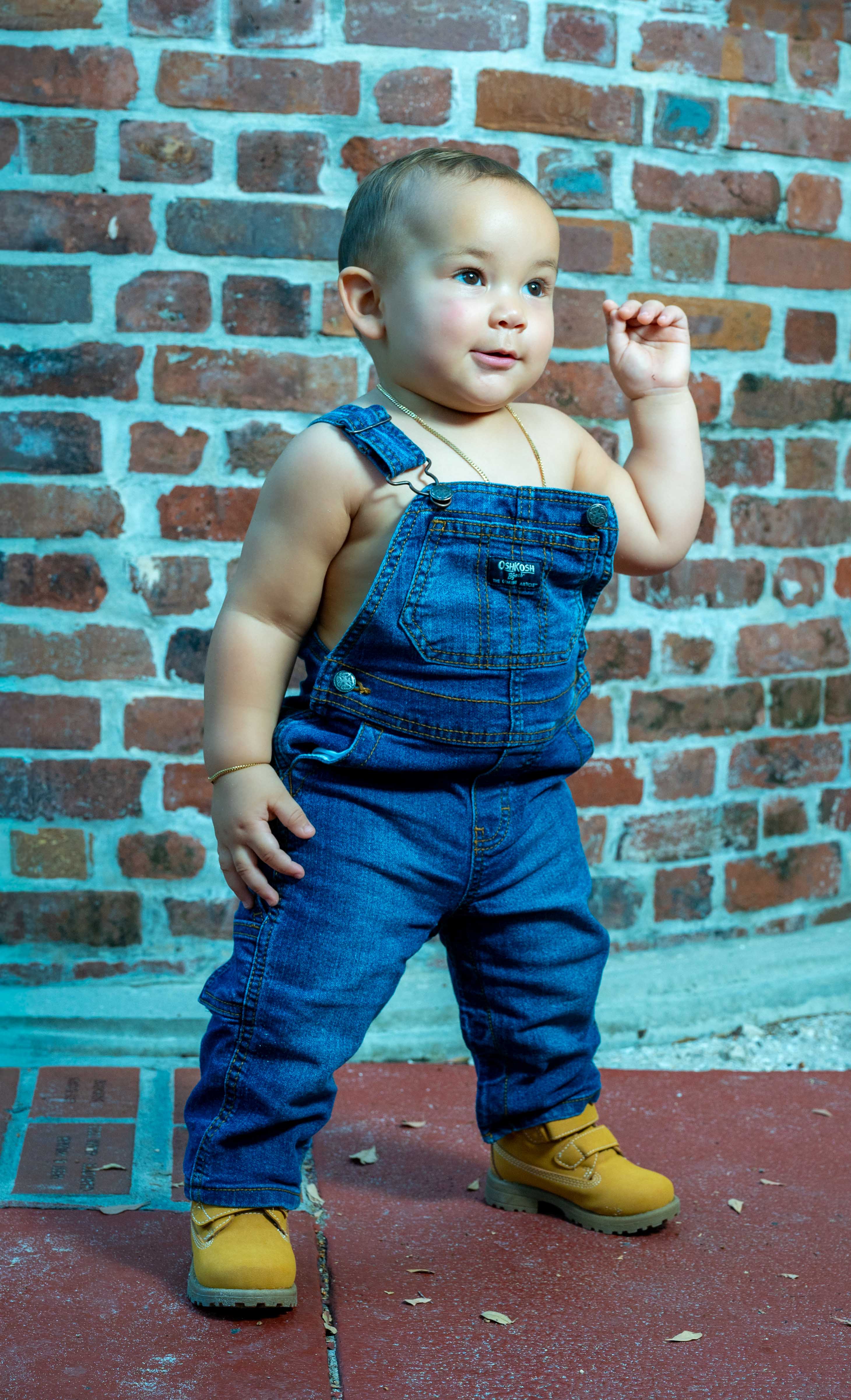 Baby candid portrait, studio-style backdrop