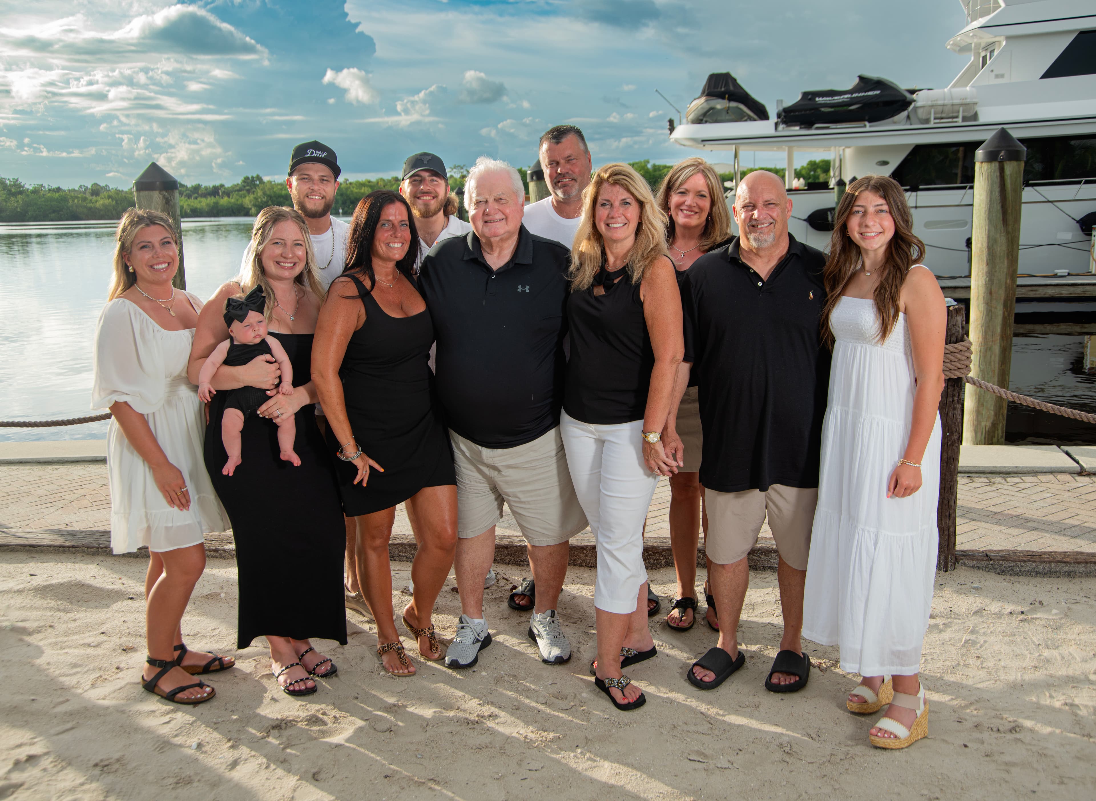 Family portrait on the waterfront dock at sunset
