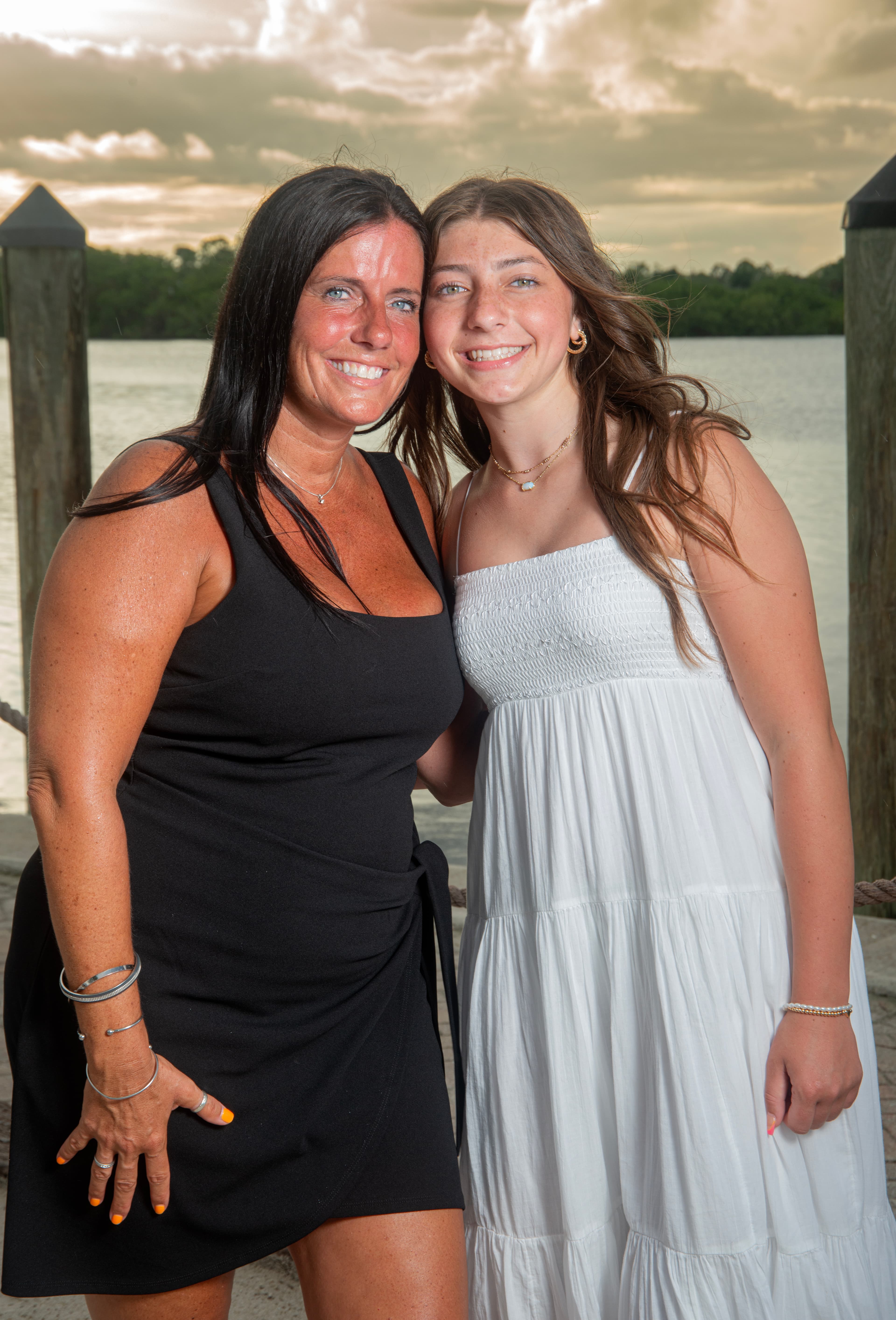 Family group photo on the dock at sunset