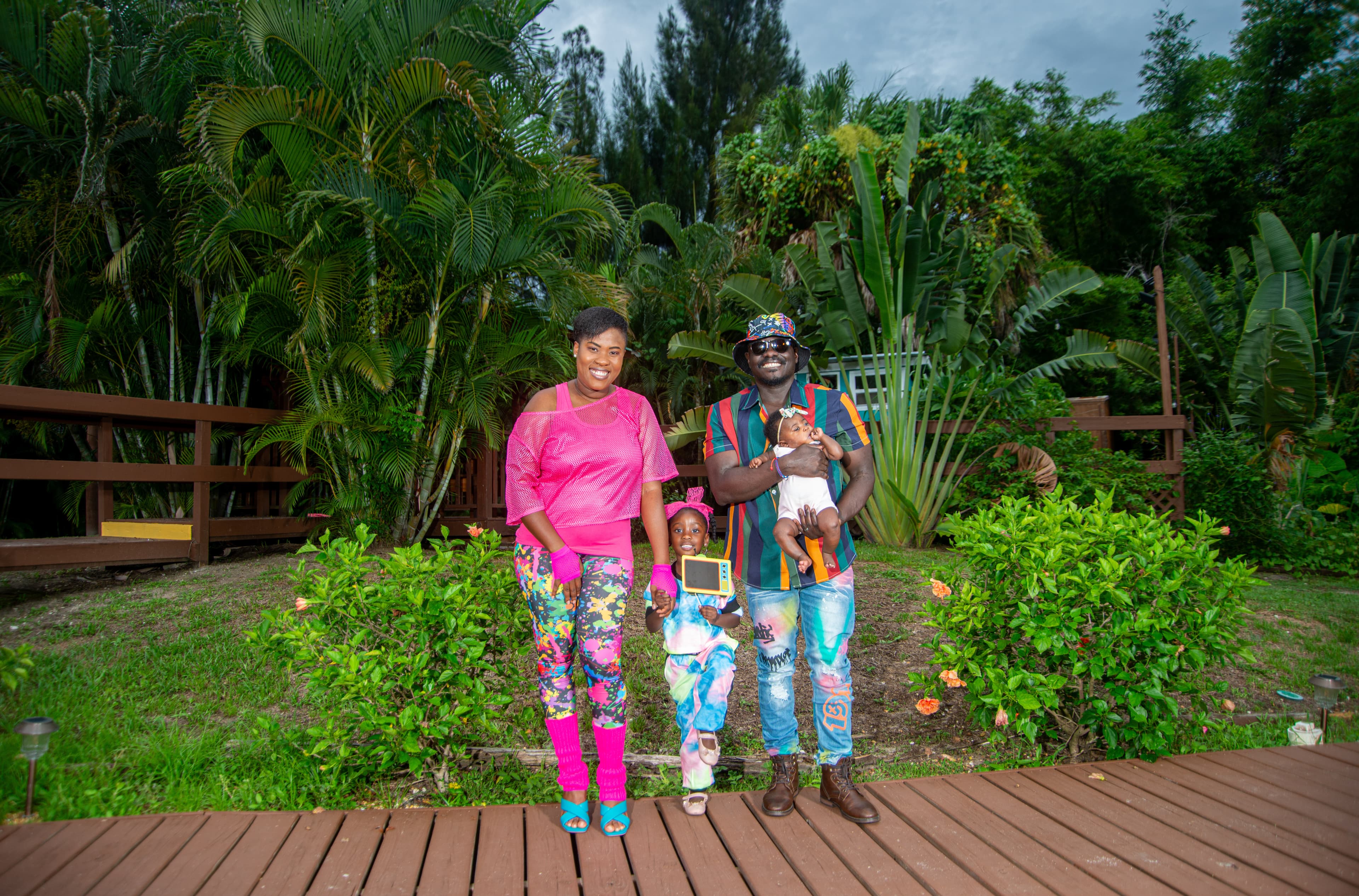 Family portrait in a tropical backyard