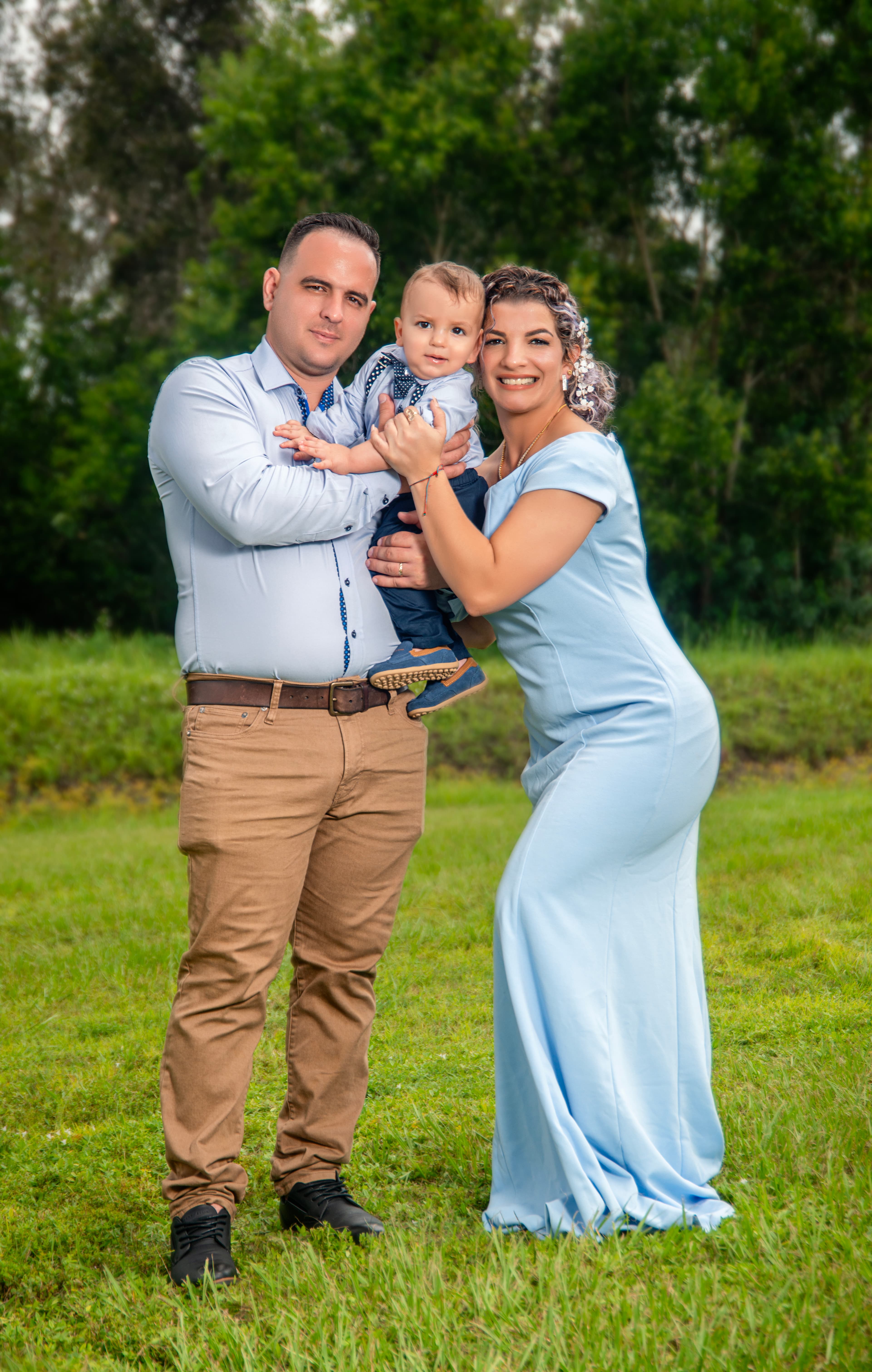 Family portrait outdoors in the grass