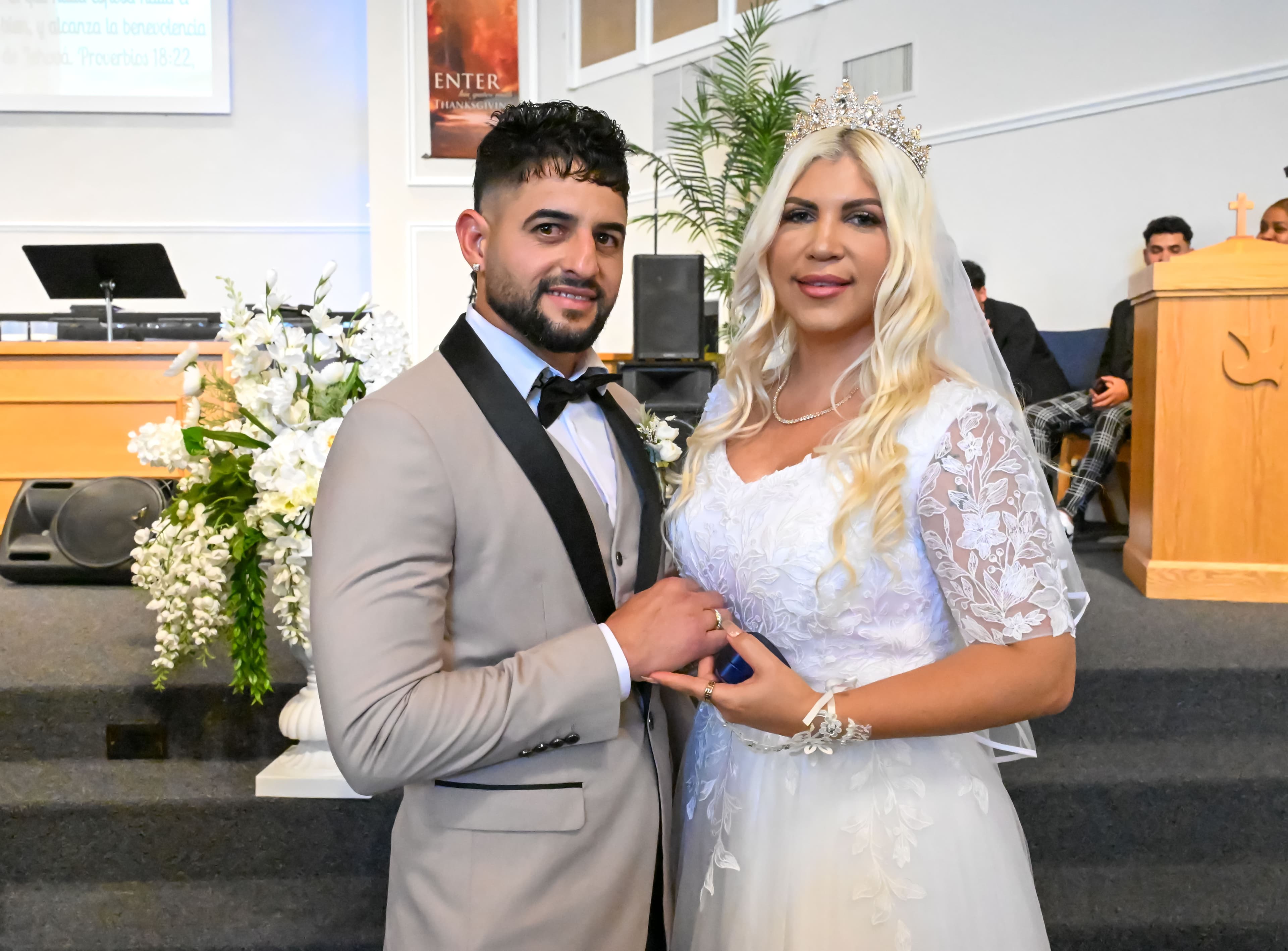 Bride and groom portrait after the ceremony, church aisle