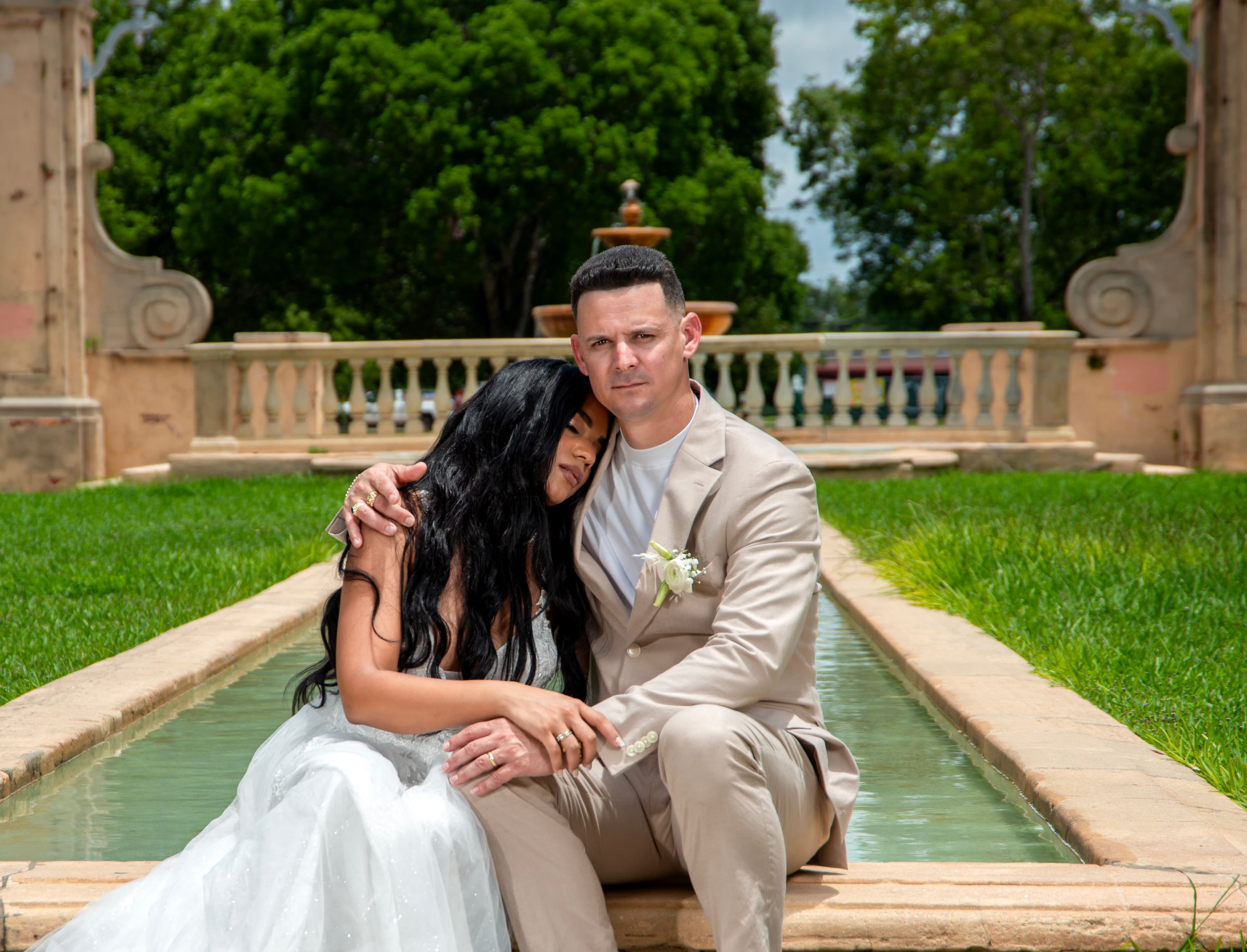 Wedding portrait, groom shielding his bride